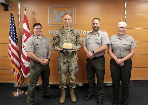 Col. Andrew Baker, USACE LA District commander, receives a USACE Park Ranger campaign hat during his last USACE LA District town hall June 3 in the LA District headquarters building.