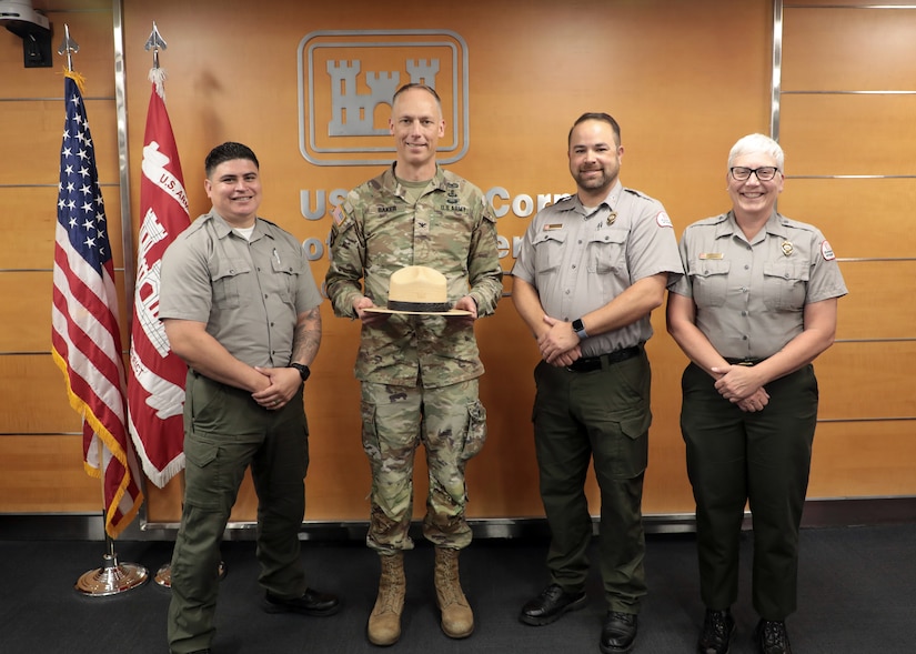 Col. Andrew Baker, USACE LA District commander, receives a USACE Park Ranger campaign hat during his last USACE LA District town hall June 3 in the LA District headquarters building.