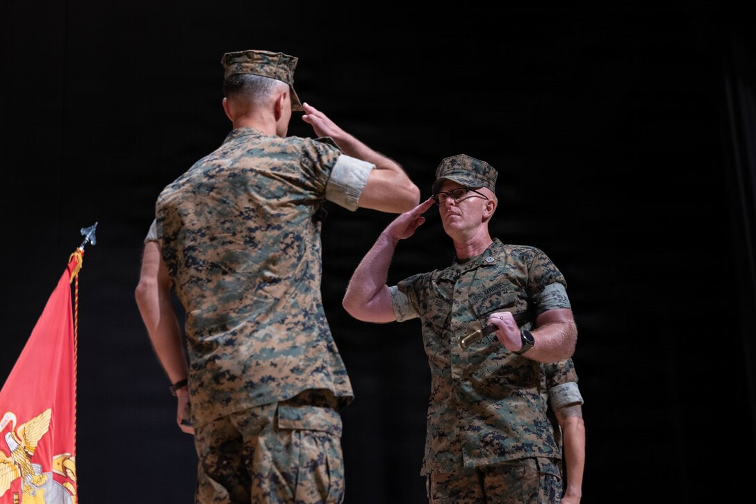 U.S. Marine Corps Sgt. Maj. Steven Kern, right, the outgoing sergeant major of Headquarters and Headquarters Squadron (H&HS), Marine Corps Air Station Iwakuni, salutes Lt. Col. Federico Mendizabal, the commanding officer of H&HS, MCAS Iwakuni, during a relief and appointment ceremony at MCAS Iwakuni, Japan, June 3, 2026. Relief and appointment ceremonies are a tradition that represents the transfer of responsibility, authority, and accountability from one sergeant major to another. (U.S. Marine Corps photo by Lance Cpl. Siwan Lewis)