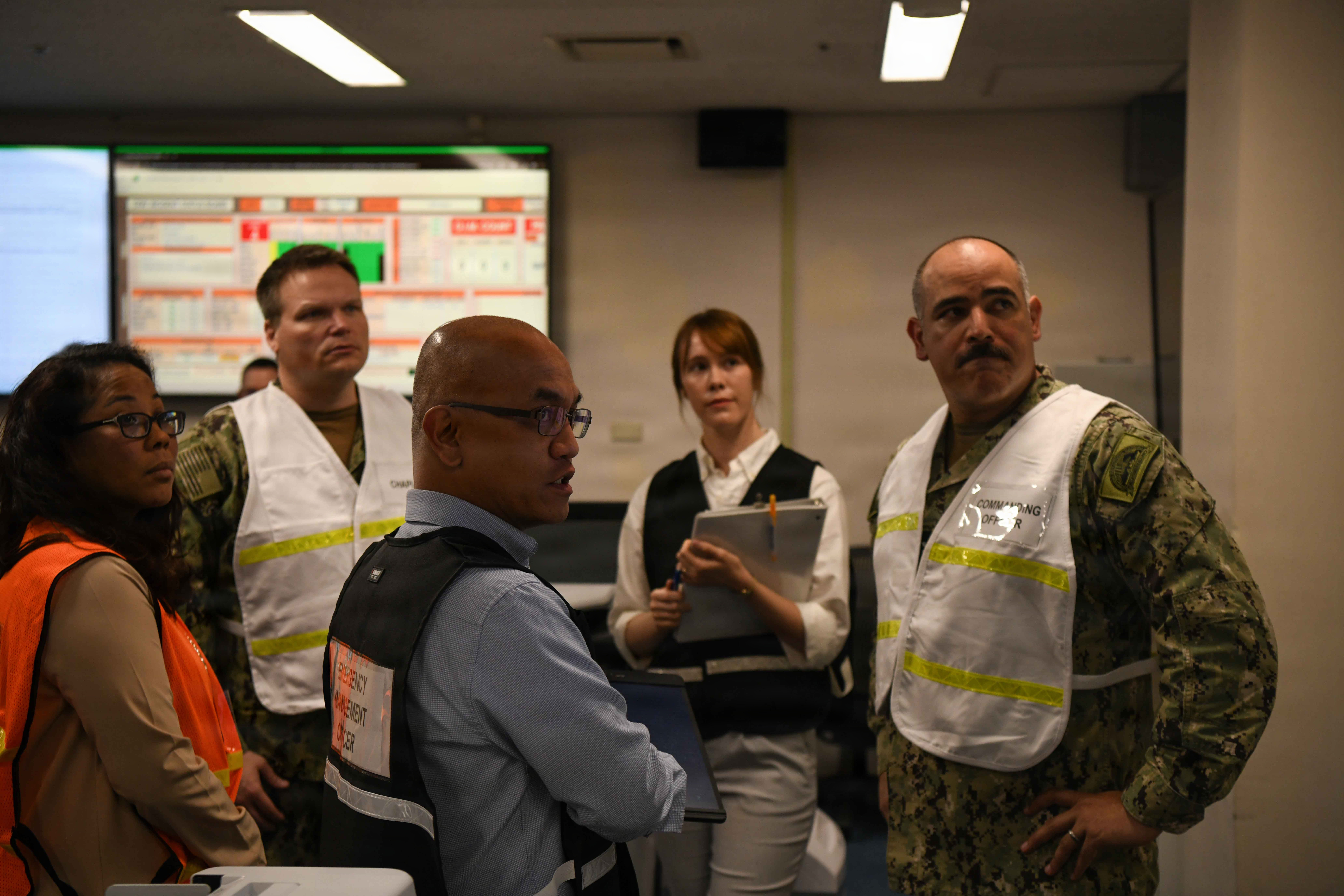 Capt. Jon Hopkins, Commander, Fleet Activities Yokosuka (CFAY), oversees an integrated training team drill in the Emergency Operations Center (EOC).