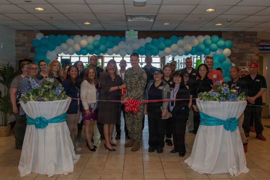 Cmdr. Patrick Gutierrez, Commander, Fleet Activities Yokosuka (CFAY) chief staff officer, and Morale, Welfare and Recreation’s Food and Beverage Director Richarda Rodriguez cut the ceremonial ribbon for the opening of Seaside Café at CFAY, May 4, 2026. For more than 80 years, CFAY has provided, maintained, and operated base facilities and services in support of the U.S. 7th Fleet's forward-deployed naval forces, tenant commands, and thousands of military and civilian personnel and their families.