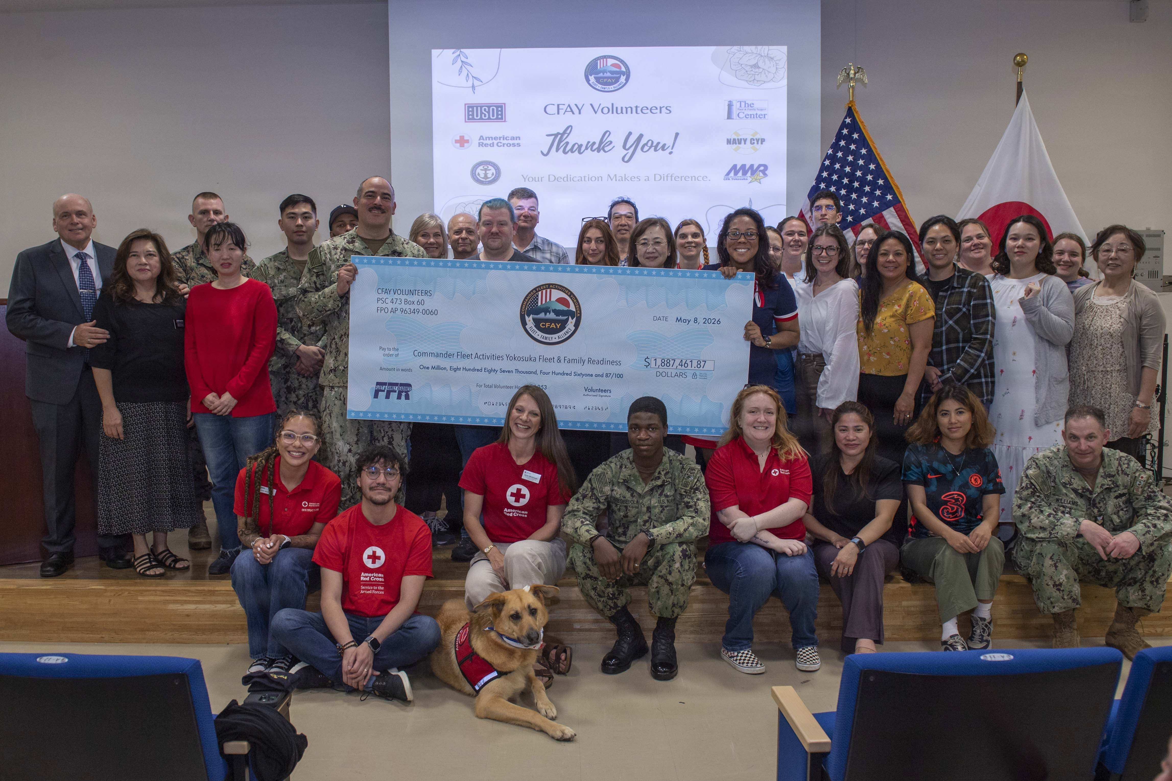 Staff members of the Fleet and Family Support Center and volunteers pose for a photo during a volunteer appreciation ceremony at Commander, Fleet Activities Yokosuka (CFAY) Community Resource Center, May 8, 2026.