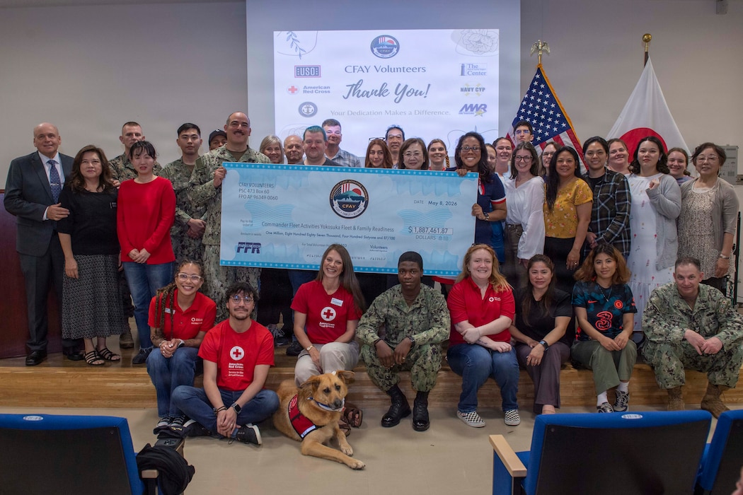 Staff members of the Fleet and Family Support Center and volunteers pose for a photo during a volunteer appreciation ceremony at Commander, Fleet Activities Yokosuka (CFAY) Community Resource Center, May 8, 2026.