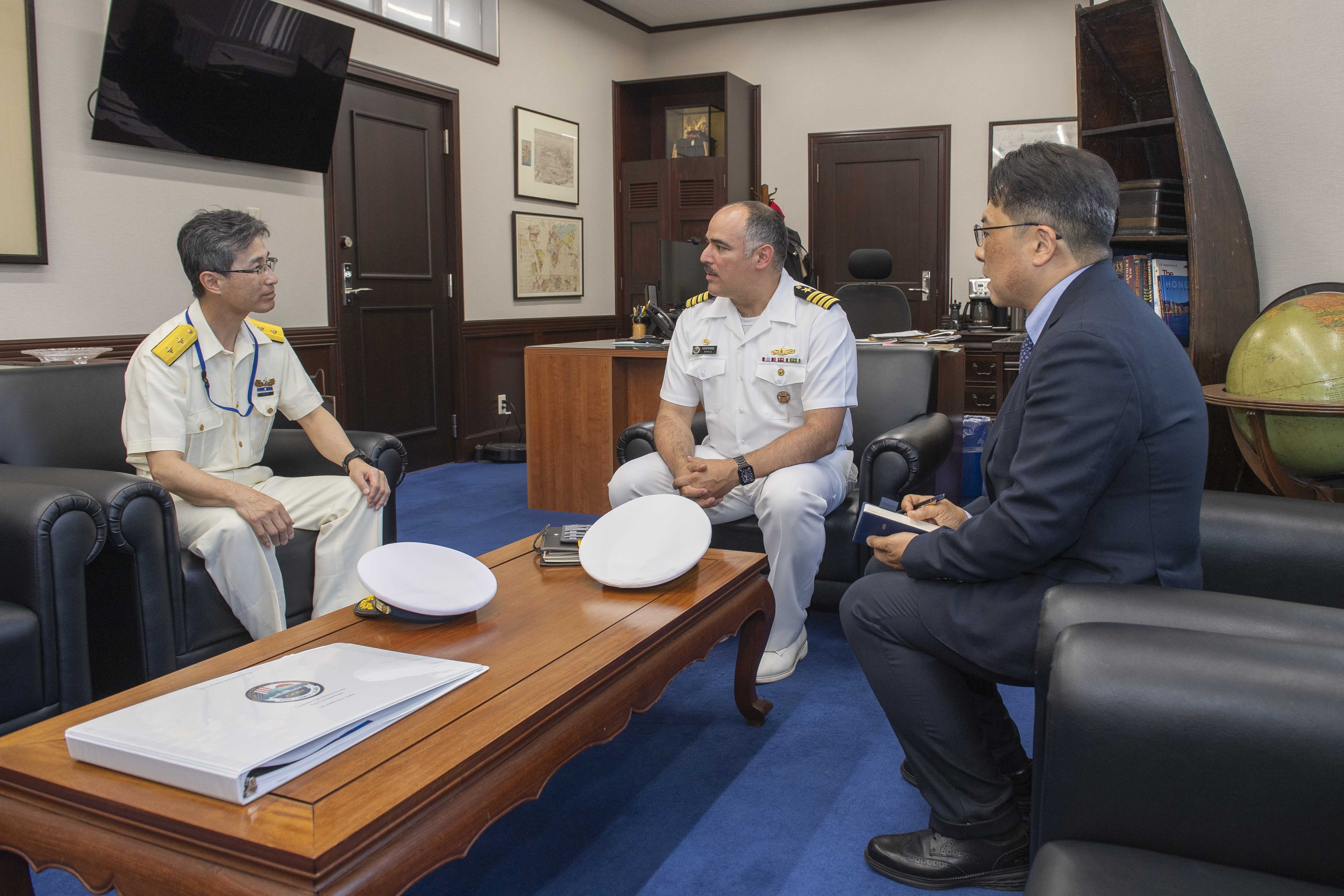 Capt. Jon Hopkins, Commander, Fleet Activities Yokosuka (CFAY), speaks with Japan Coast Guard Rear Adm. Makoto Tatsumiya, chief of Yokosuka Coast Guard Office, during an office call at building C-2, CFAY headquarters, May 11, 2026.