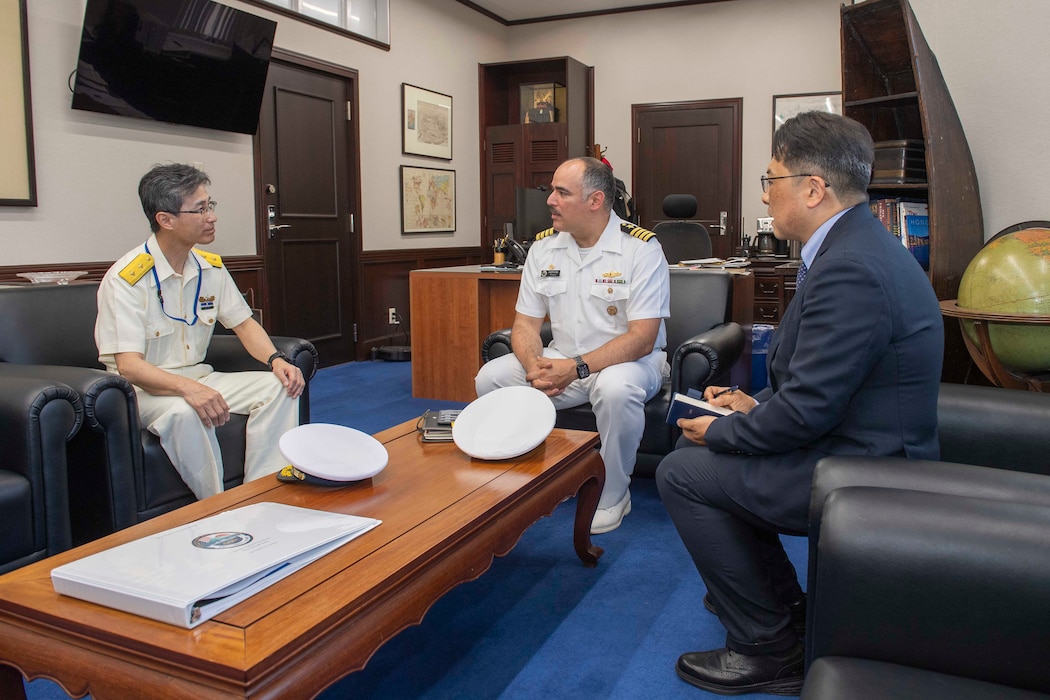 Capt. Jon Hopkins, Commander, Fleet Activities Yokosuka (CFAY), speaks with Japan Coast Guard Rear Adm. Makoto Tatsumiya, chief of Yokosuka Coast Guard Office, during an office call at building C-2, CFAY headquarters, May 11, 2026.