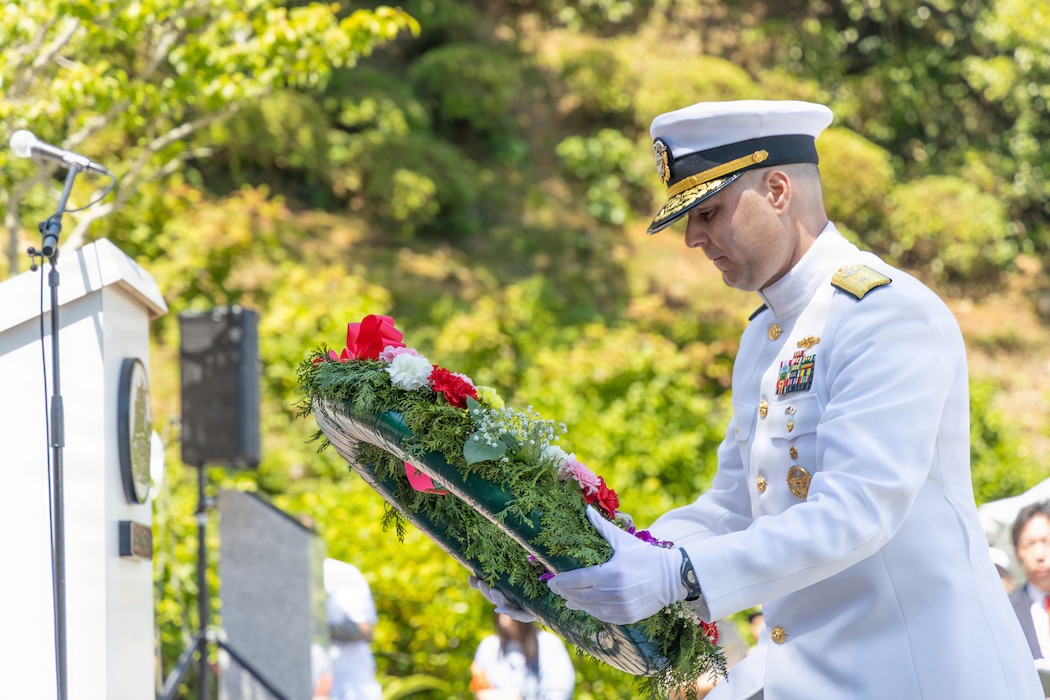 Rear Adm. lan Johnson, commander, U.S. Naval Forces Japan/Navy Region Japan, participates in a wreath-laying during ceremony of the 87th Annual Black Ship Festival at Shimoda Park in Shimoda, Japan, May 16, 2026. The festival commemorates the 1854 arrival of Commodore Matthew C. Perry and his "black ships" to Shimoda, and the subsequent signing of the Japan-U.S. Treaty of Peace and Amity marking the start of diplomacy and trade between both countries.
