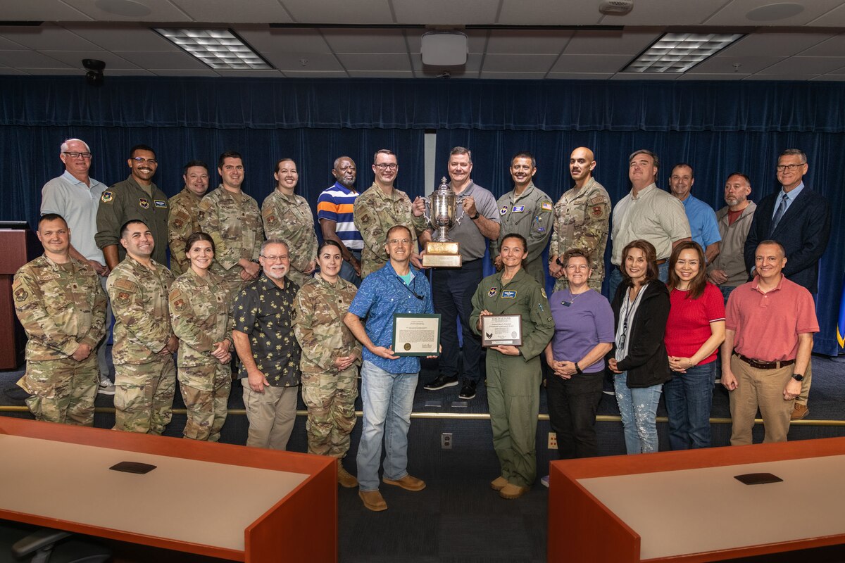 Lieutenant General (Retired)Richard “Tex” Brown presents the General Muir S. Fairchild Award to the Warfighting Education Directorate of the Ira C. Eaker Center for Leadership Development. The award is a Daedalian trophy and award presented to an individual or organization assigned to Air University judged by the commander, Air University, to have made the most significant contribution to Air University Education or to the Air Force education in general.