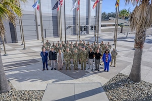 Lt. Gen. Dennis Bythewood and S4S senior leaders pose for a group photo.