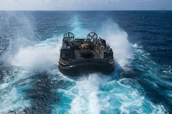 U.S. Navy landing craft, air cushion with Assault Craft Unit 5, disembarks Wasp-class amphibious assault ship USS Boxer (LHD 4) during LCAC operations in the South China Sea, June 5, 2026.