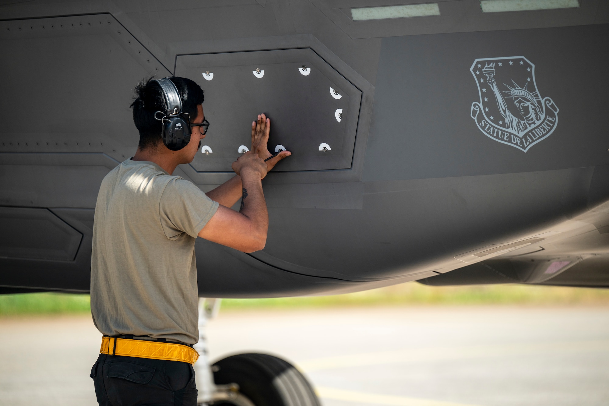 U.S. Air Force Airman 1st Class Edgar Rosas, 493rd Fighter Generation Squadron crew chief, conducts preflight checks to an F-35A Lightning II aircraft during Ramstein Flag 26 at Pirkkala Air Base, Finland, June 8, 2026. The exercise tests the 48th Fighter Wing's capacity for Agile Combat Employment, ensuring Airmen can sustain high-tempo combat operations with a minimal footprint in a distributed environment. (U.S. Air Force photo by Tech. Sgt. Christine Groening)