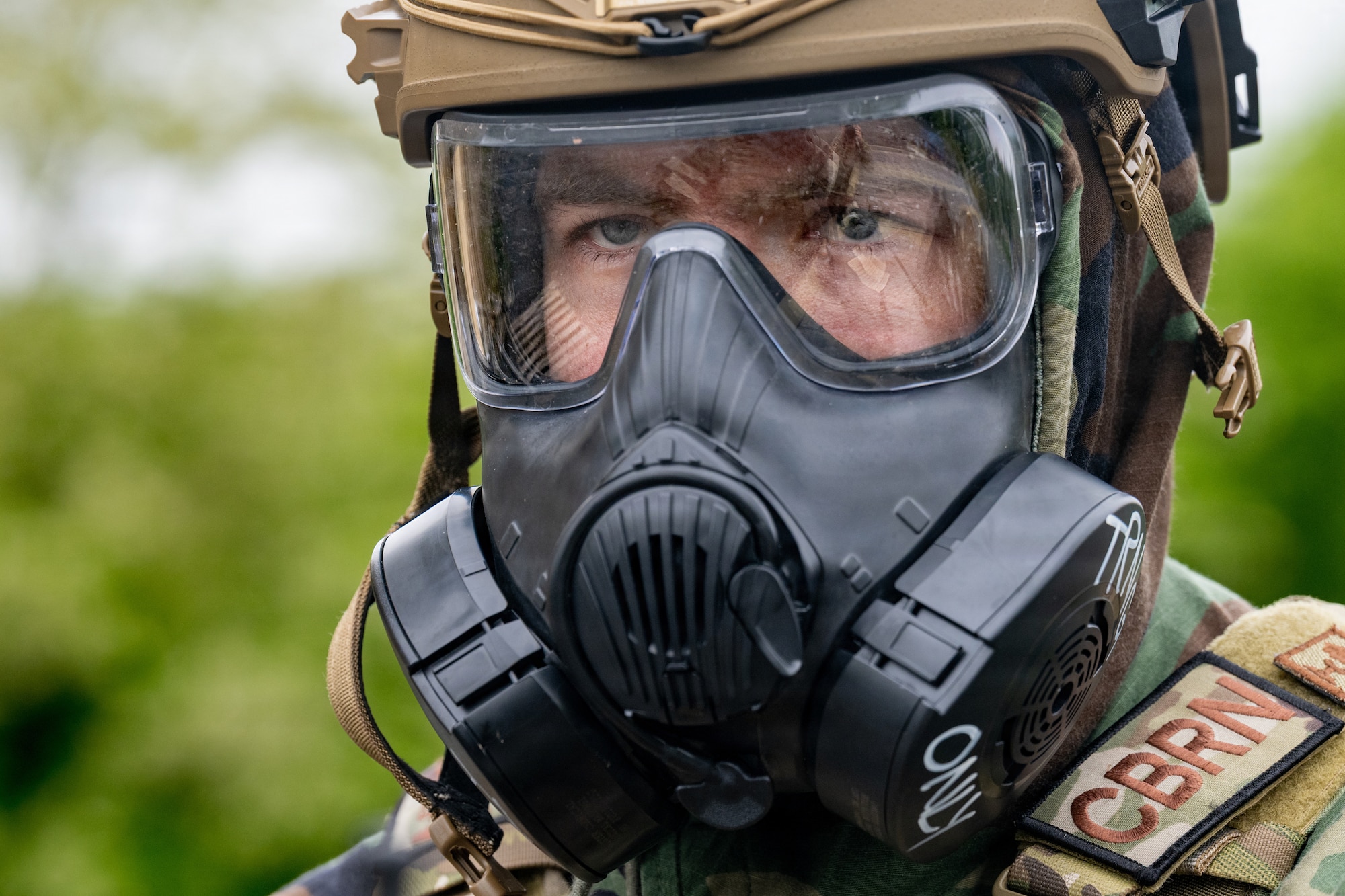 U.S. Air Force Staff Sgt. James Fink, 35th Civil Engineer Squadron (CES) emergency management noncommissioned officer in charge of logistics and training, scans the surroundings for a simulated drone during a chemical, biological, radiological and nuclear training.
