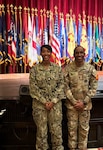 Twins, U.S. Navy Senior Chief Hospital Corpsman Vanessa Green, senior enlisted leader, education and training, Naval Medical Forces Development Command, and U.S. Army Environmental Command Command Sgt. Maj. Vincent Green pose for a photo, Dec. 5, 2025. For the first time in more than two decades, the siblings are serving together, just one mile apart, at Joint Base San Antonio-Fort Sam Houston. (Courtesy photo)
