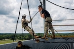 Sgt. 1st Class Nick Thomas, an Oklahoma Army National Guard recruiter and rappel master, speaks to a cadet during rappel training at the Junior Reserve Officers’ Training Corps Cadet Leadership Challenge at Camp Gruber Training Center near Braggs, Okla., May 27, 2026. The program is supported by the Oklahoma National Guard and combines leadership instruction, adventure training and team-building exercises designed to challenge cadets outside their comfort zones. (Oklahoma National Guard photo by Sgt. Danielle Rayon)Sgt. 1st Class Nick Thomas, an Oklahoma Army National Guard recruiter and rappel master, speaks to a cadet during rappel training at the Junior Reserve Officers’ Training Corps Cadet Leadership Challenge at Camp Gruber Training Center near Braggs, Okla., May 27, 2026. The program is supported by the Oklahoma National Guard and combines leadership instruction, adventure training and team-building exercises designed to challenge cadets outside their comfort zones. (Oklahoma National Guard photo by Sgt. Danielle Rayon)