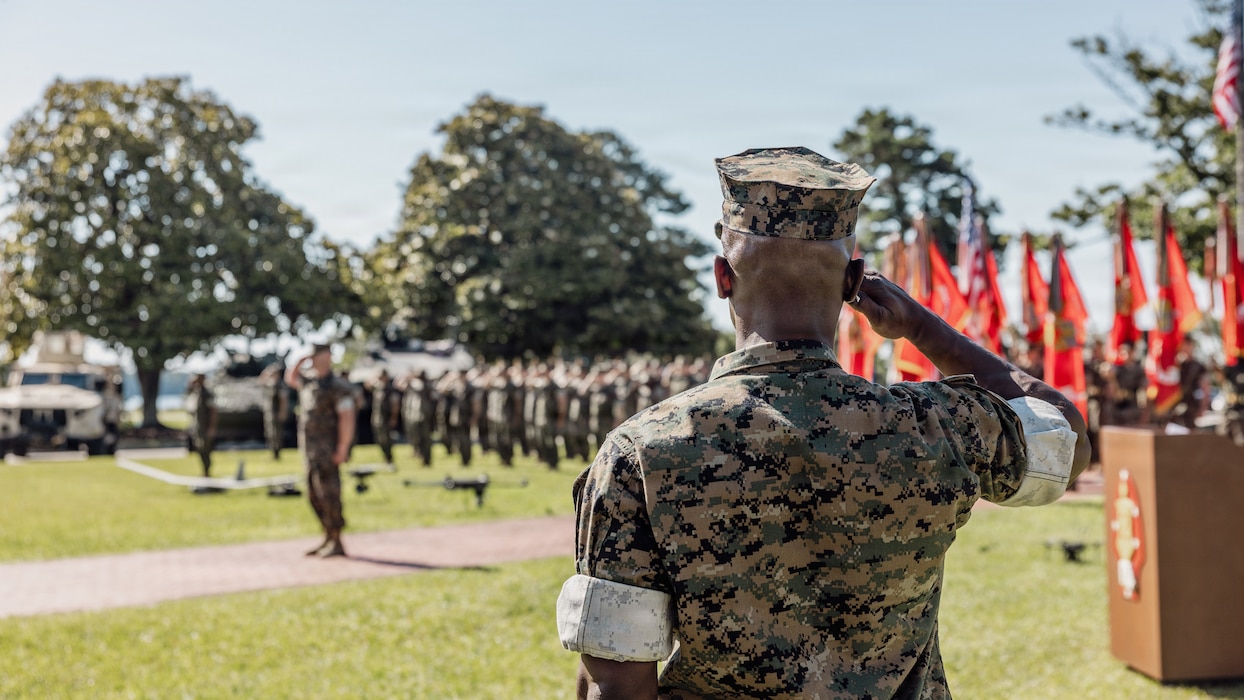 U.S. Navy Lt. Mark Cannon, a chaplain with Marine Aircraft Group 14, 2nd Marine Air Wing, salutes during the national anthem as part of a relief and appointment ceremony on Marine Corps Base Camp Lejeune, North Carolina, June 05, 2026. SgtMaj. Joseph Mendez, the outgoing sergeant major of 2nd Marine Division, relinquished command to SgtMaj. Christopher Singley, the oncoming sergeant major of 2nd Marine Division, which signified the transfer of accountability, responsibility and authority of new leadership to the new command. (U.S. Marine Corps photo by Lance Cpl. Dominic Trujillo)