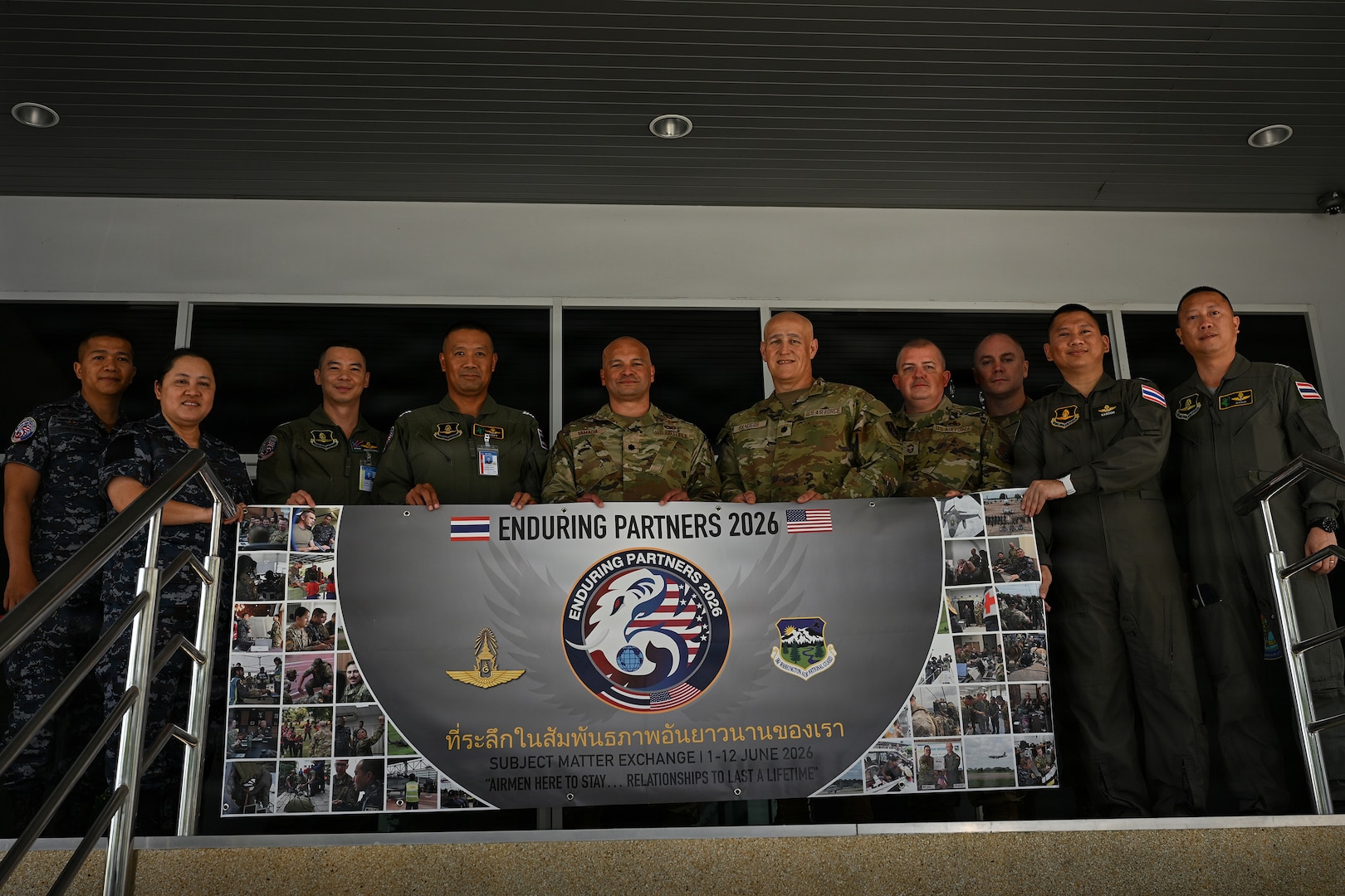 Royal Thai Air Force and Washington Air National Guard personnel hold a banner for Enduring Partners 2026 on Don Muang Royal Thai Air Force Base, Bangkok, June 2, 2026.