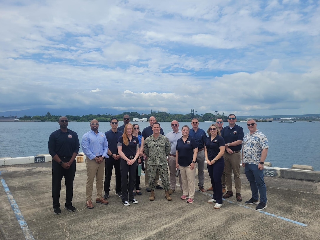 A group stands for a photo at a port