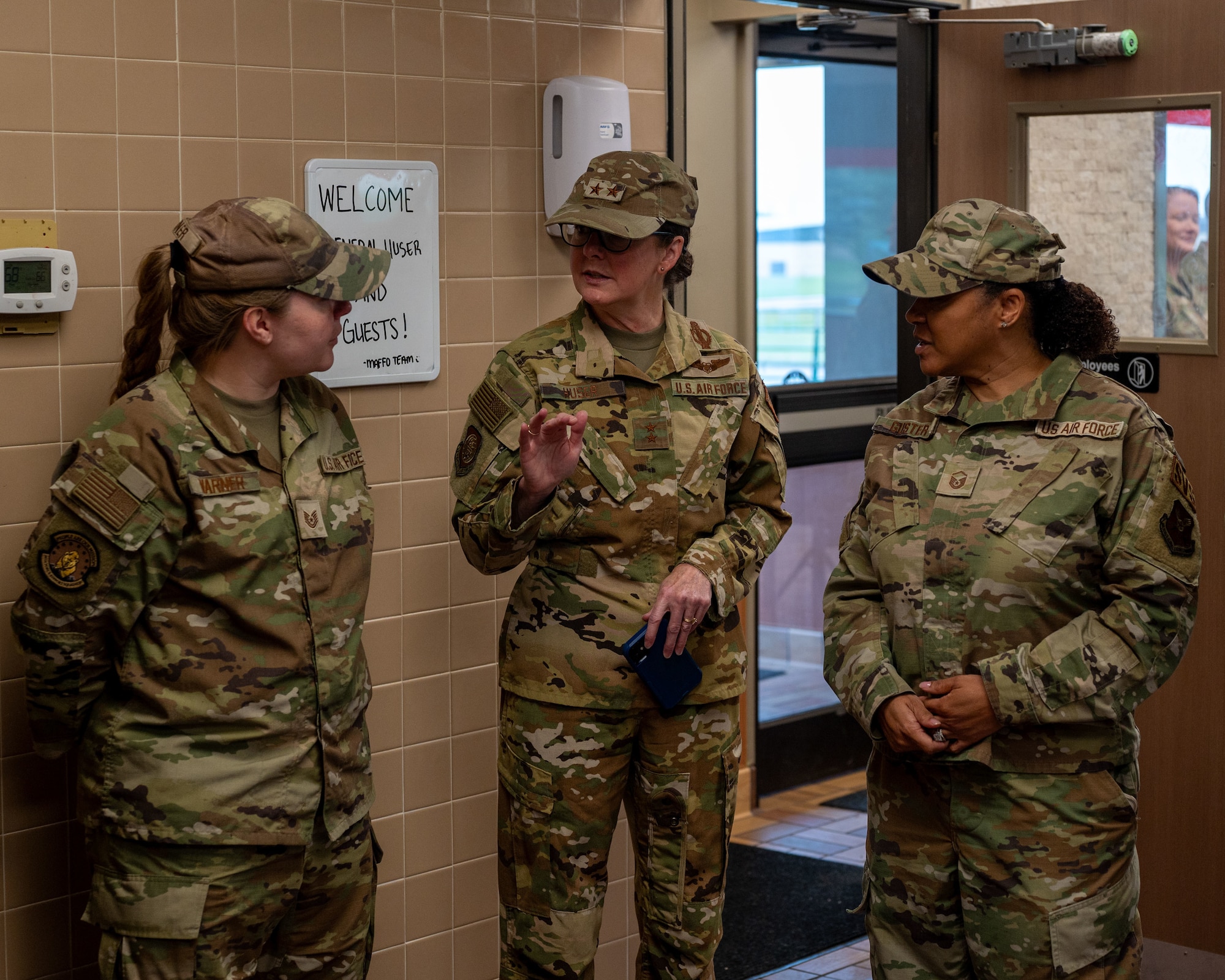 U.S. Air Force Maj. Gen. Stacy Jo Huser, center, 20th Air Force commander, discusses missile alert facility feeding operations (MAFFO) with Tech. Sgt. Abbey Warner, left, 341st Force Support Squadron missile feeding noncommissioned officer in charge, and Master Sgt. Marie Guster, 341 FSS MAFFO section chief, at Malmstrom Air Force Base, Montana, June 1, 2026.