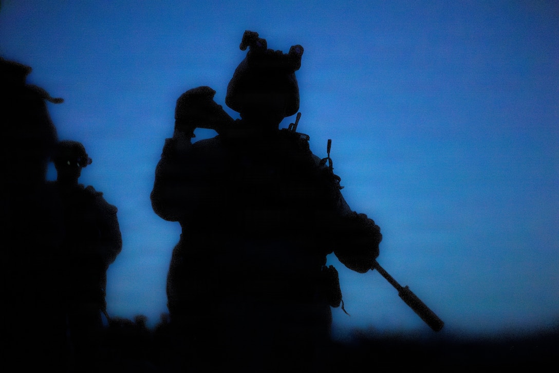 A U.S. Marine with 1st Battalion, 24th Marines, 4th Marine Division, patrols towards a simulated enemy position during a live fire night platoon attack on Range 410 Alpha as part of Integrated Training Exercise 3-26, Marine Corps Air Ground Combat Center Twentynine Palms, California, June 7, 2026. ITX is designed to generate combat readiness and ensure the Reserve Component provides critical strategic depth to the Total Force. From complex combined arms maneuvers to all-domain integration, these Marines are proving that they are ready to augment, reinforce, and fight alongside the active component at a moment's notice. (U.S. Marine Corps photo by Cpl. Van Hoang)