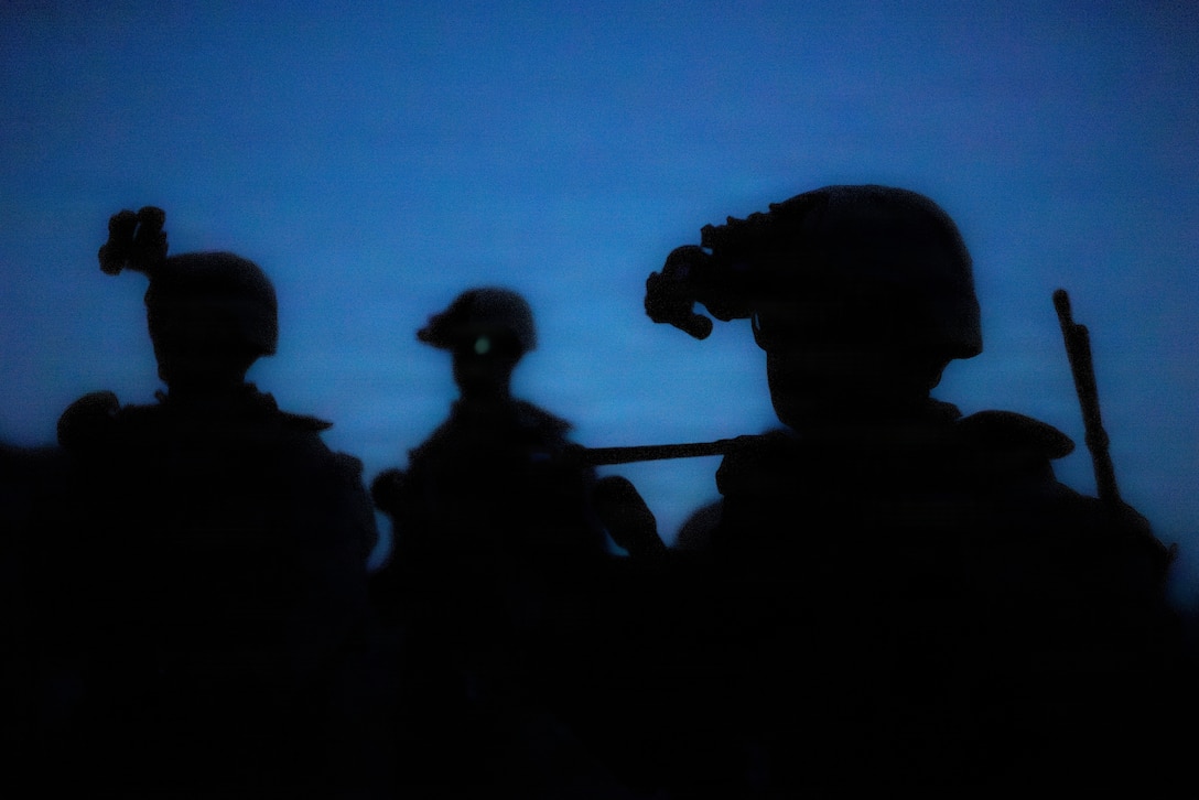 U.S. Marines with 1st Battalion, 24th Marines, 4th Marine Division, maneuver through a wash during a live fire night platoon attack on Range 410 Alpha as part of Integrated Training Exercise 3-26, Marine Corps Air Ground Combat Center Twentynine Palms, California, June 7, 2026. ITX is designed to generate combat readiness and ensure the Reserve Component provides critical strategic depth to the Total Force. From complex combined arms maneuvers to all-domain integration, these Marines are proving that they are ready to augment, reinforce, and fight alongside the active component at a moment's notice. (U.S. Marine Corps photo by Cpl. Van Hoang)
