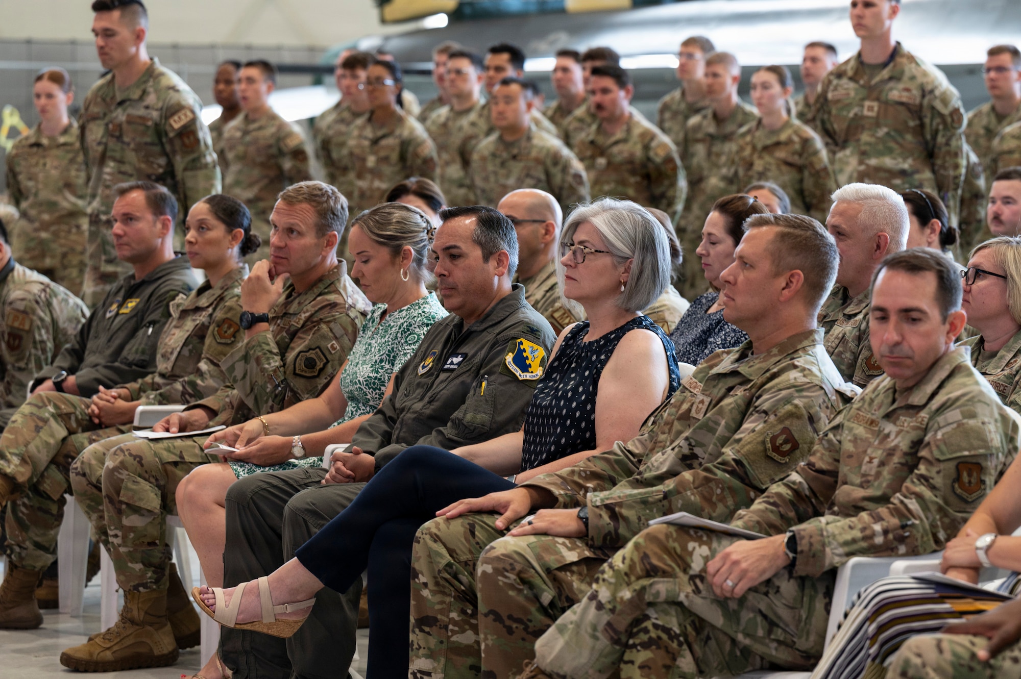 Servicemembers watch the ceremony.