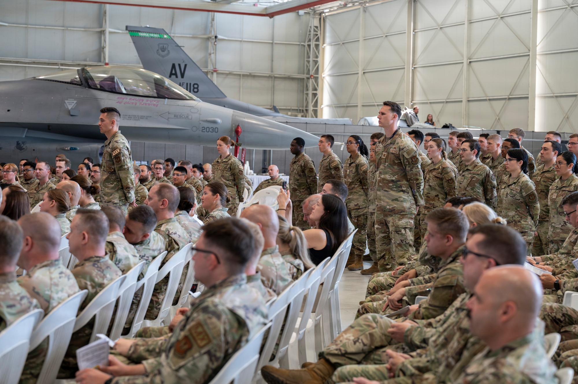 Servicemembers are watching the ceremony.