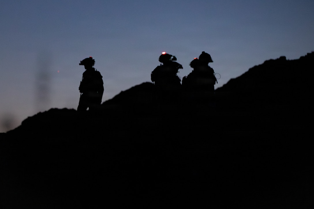 U.S. Marines with 1st Battalion, 24th Marines, 4th Marine Division, conduct pre-combat checks and inspections during a live fire night platoon attack on Range 410 Alpha as part of Integrated Training Exercise 3-26, Marine Corps Air Ground Combat Center Twentynine Palms, California, June 7, 2026. ITX is designed to generate combat readiness and ensure the Reserve Component provides critical strategic depth to the Total Force. From complex combined arms maneuvers to all-domain integration, these Marines are proving that they are ready to augment, reinforce, and fight alongside the active component at a moment's notice. (U.S. Marine Corps photo by Cpl. Van Hoang)