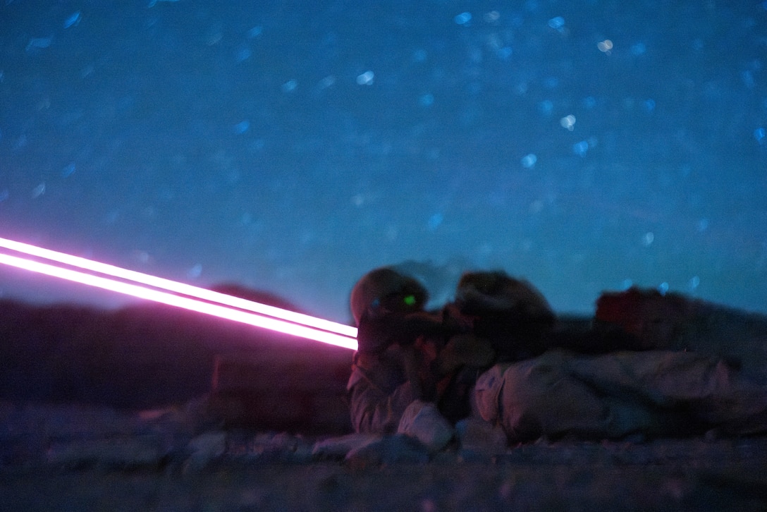 A U.S. Marine with 1st Battalion, 24th Marines, 4th Marine Division, moves to cover after being notionally wounded during a live fire night platoon attack on Range 410 Alpha as part of Integrated Training Exercise 3-26, Marine Corps Air Ground Combat Center Twentynine Palms, California, June 7, 2026. ITX is designed to generate combat readiness and ensure the Reserve Component provides critical strategic depth to the Total Force. From complex combined arms maneuvers to all-domain integration, these Marines are proving that they are ready to augment, reinforce, and fight alongside the active component at a moment's notice. (U.S. Marine Corps photo by Cpl. Van Hoang)