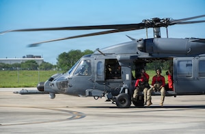 U.S. Air Force pararescuemen from the 41st Rescue Squadron, prepare to take off from Martindale Airfield during a search and rescue exercise in San Antonio, Texas, May 19, 2026. SAREX is an annual exercise which is meant to prepare and train military personnel and local first responders for large-scale natural disasters. (U.S. Air Force photo by Staff Sgt. Derek Gutierrez)