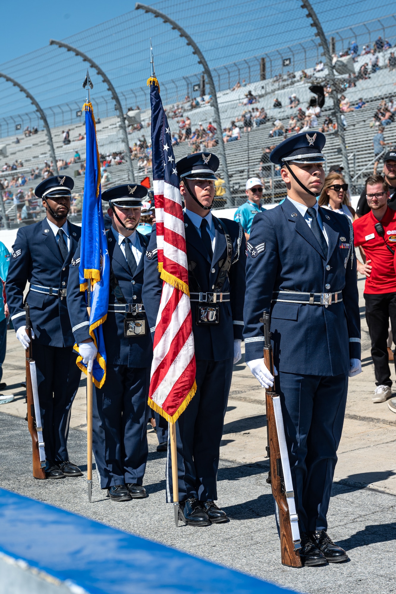 Members assigned to the 436th Airlift Wing Honor Guard stand at attention before going on the stage at the Dover Motor Speedway in Dover, Delaware, May 16, 2026.