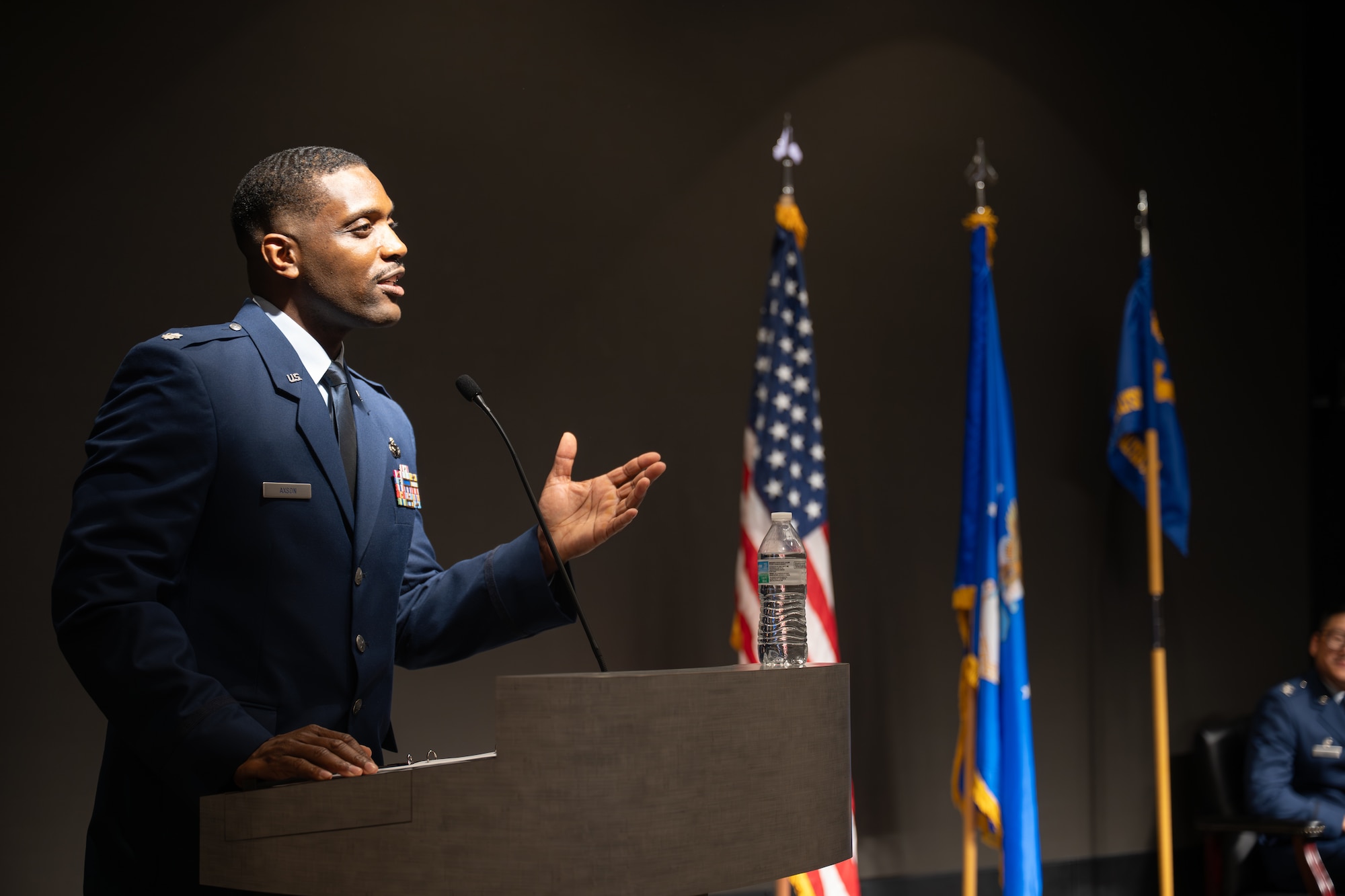 Lt. Col. Ty Axson, Information Warfare Analysis Squadron incoming commander, addresses squadron personnel during a change of command ceremony at the Air Force Institute of Technology, Wright-Patterson Air Force Base, Ohio, June 5, 2026. After assuming command, Axson outlined his vision for the squadron's future, highlighting its role in enabling the U.S. to achieve and preserve a decisive information and decision advantage. (U.S. Air Force photo by Staff Sgt. Kristof J. Rixmann)