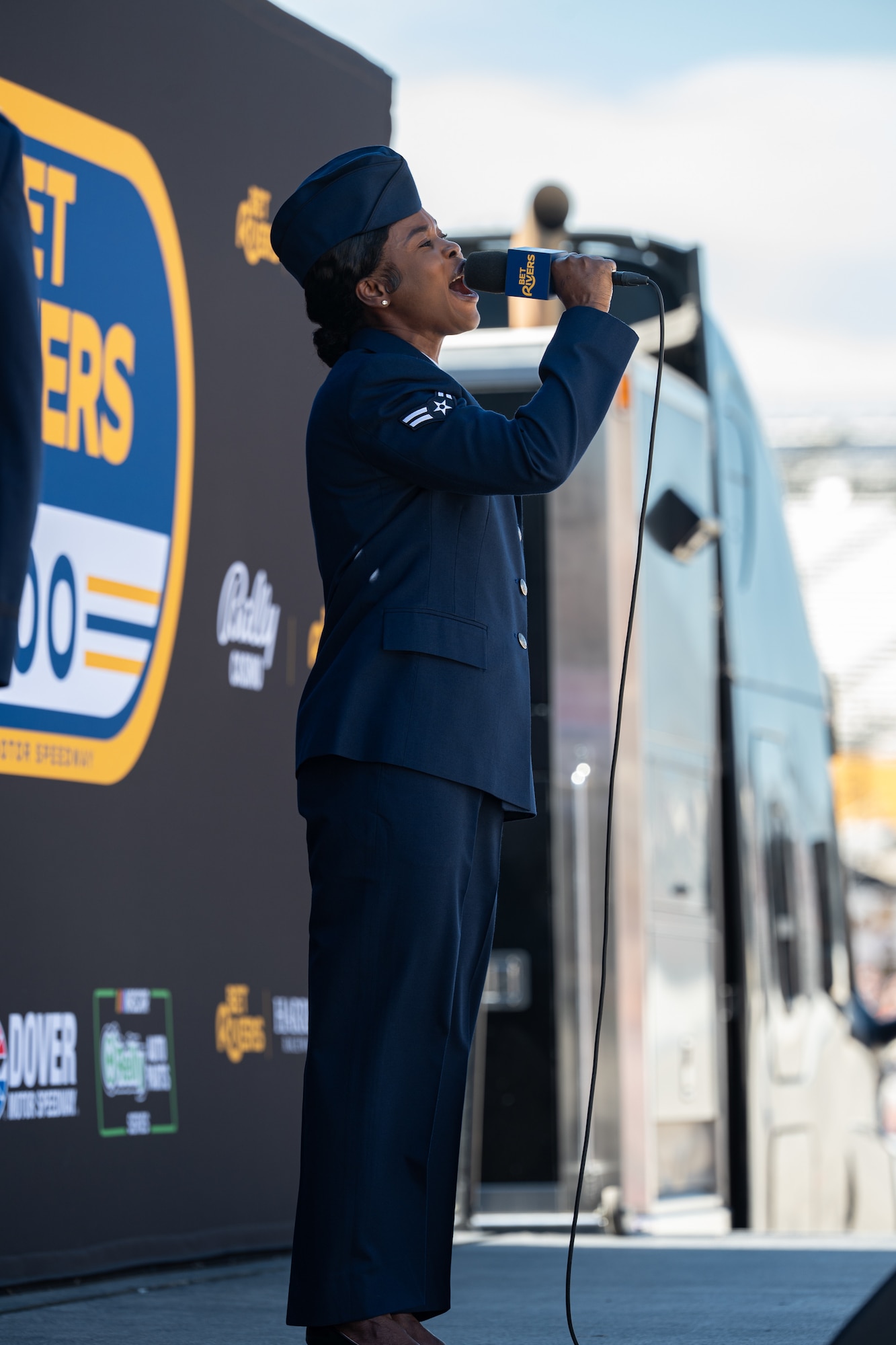 U.S. Air Force Airman 1st Class Diana Antwi-Boasiako, 436th Medical Group public health apprentice, sings “The Star-Spangled Banner” before the NASCAR O’Reilly Series BetRivers 200 at the Dover Motor Speedway in Dover, Delaware, May 16, 2026. Antwi-Boasiako auditioned and was chosen out of six applicants to perform the national anthem during race weekend. (U.S. Air Force photo by Airman 1st Class Macy Dismore-Mann)