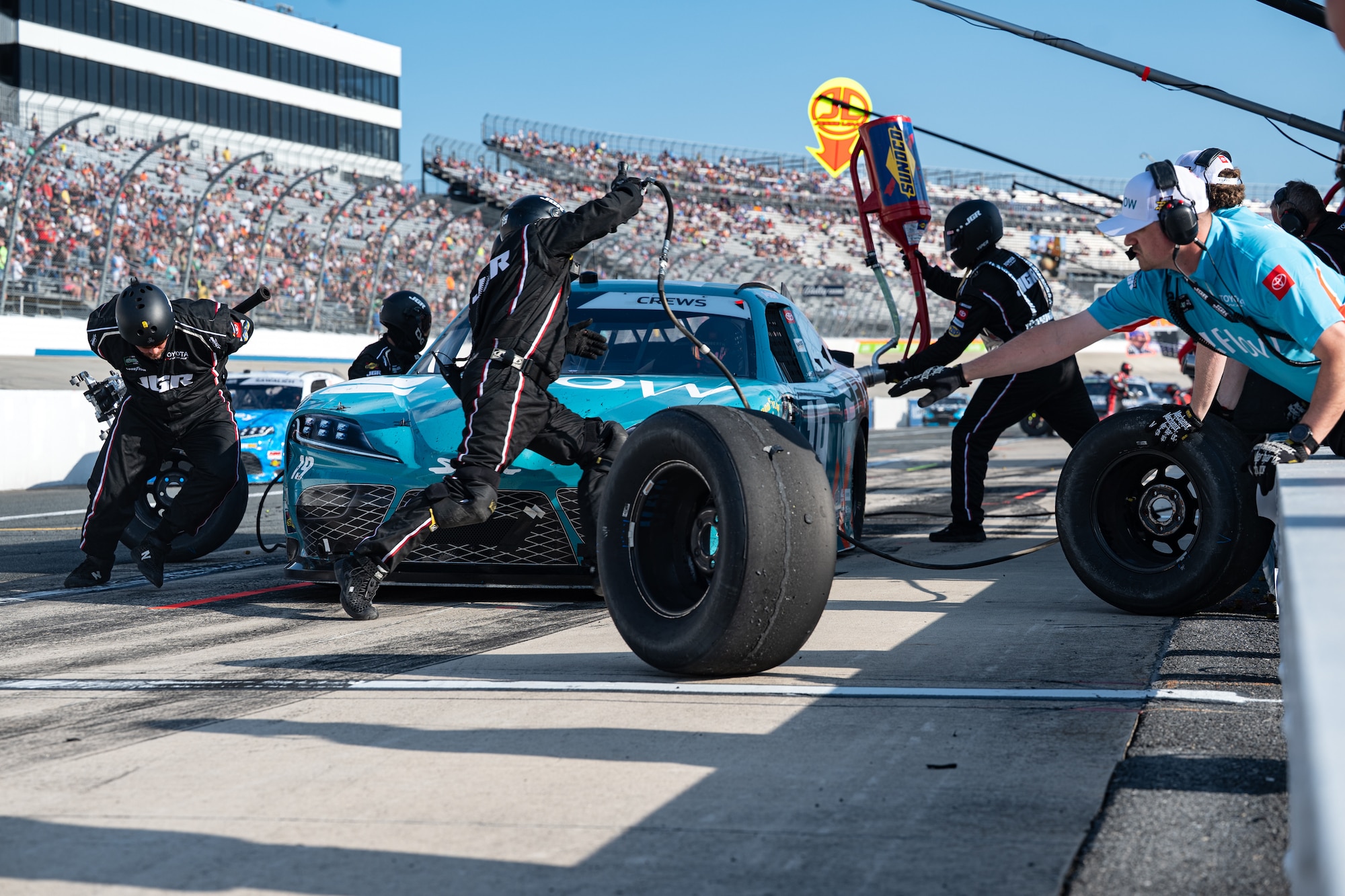 Crew members of the Joe Gibbs No. 19 Toyota team race to quickly change the tires during a 250-lap race at Dover Motor Speedway in Dover, Delaware, May 16, 2026. The NASCAR O’Reilly Series BetRivers 200 consisted of 38 drivers and two 75-lap segments to determine the racers in the final 200-lap race. (U.S. Air Force photo by Airman 1st Class Macy Dismore-Mann)
