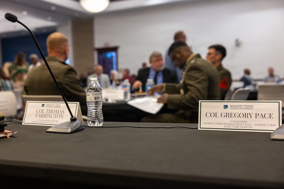 Name placards for U.S. Marine Corps Col. Gregory Pace, commanding officer, Marine Corps Installations East–Marine Corps Base Camp Lejeune, and Col. Thomas C. Farrington II, commanding officer, Marine Corps Air Station New River, at the 2026 State of the Community Luncheon at the Onslow County Government Center, in Jacksonville, North Carolina, June 4, 2026. This event highlighted the importance of collaboration between military, local government, businesses and community organizations. (U.S. Marine Corps Photo by Cpl. Jessica J. Mazzamuto)