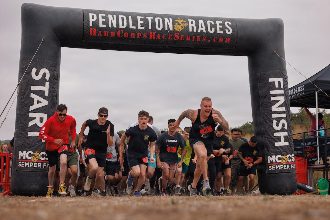 Competitors begin the annual Chesty Challenge Mud Run, hosted by Marine Corps Community Services’ Hard Corps Race Series at Lake O’Neill, Camp Pendleton, Calif., June 5, 2026. The active-duty-only event fosters camaraderie, physical resilience, and esprit de corps while awarding Commanding General’s Cup points to participating units. (U.S. Marine Corps photo by Sgt. Fourmet-Gustavsen)
