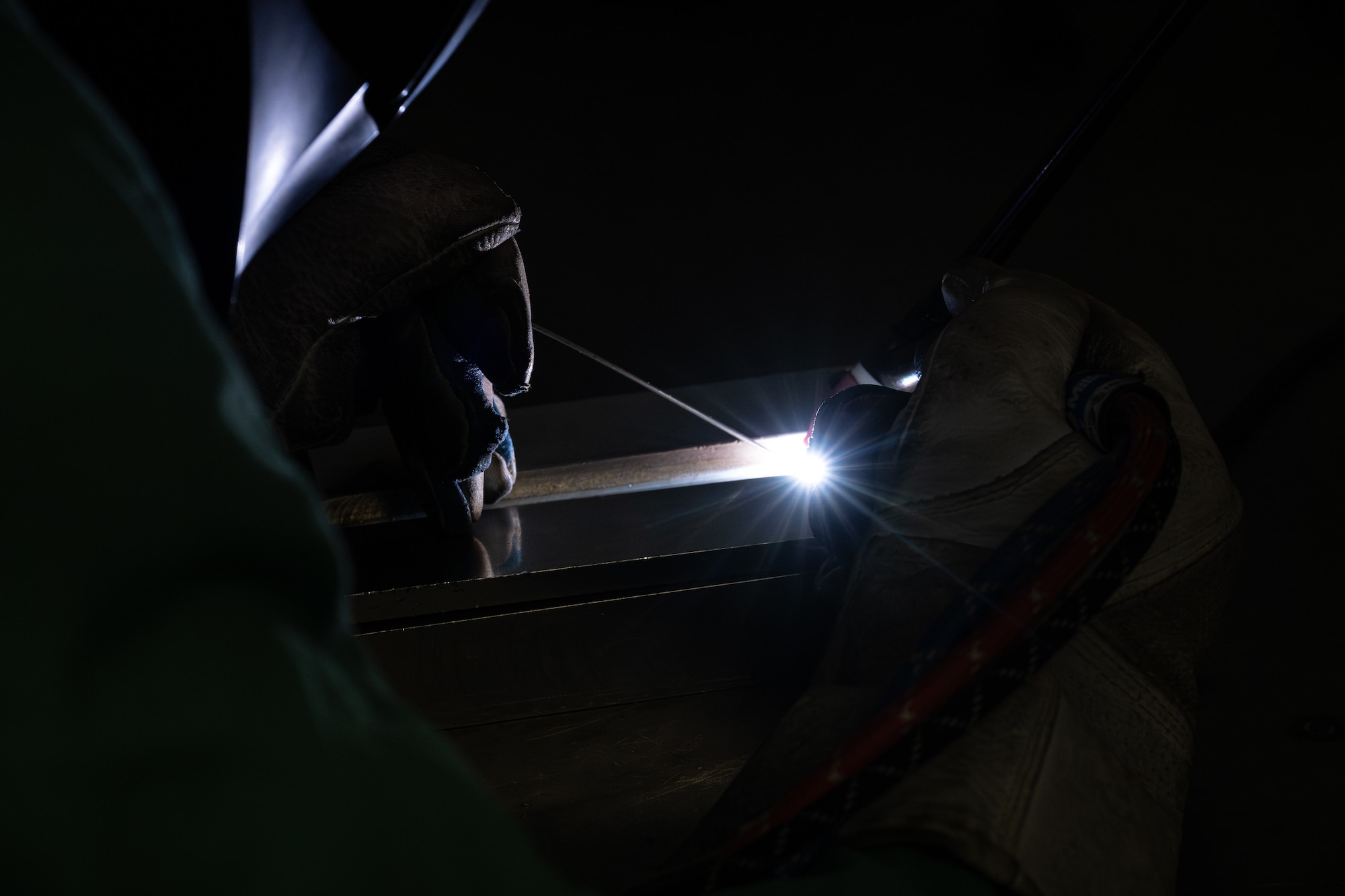 U.S. Air Force Airman 1st Class Joseph Williams, 436th Maintenance Squadron metals technology apprentice, uses a welding machine to combine two pieces into one on Dover Air Force Base, Delaware, June 4, 2026.