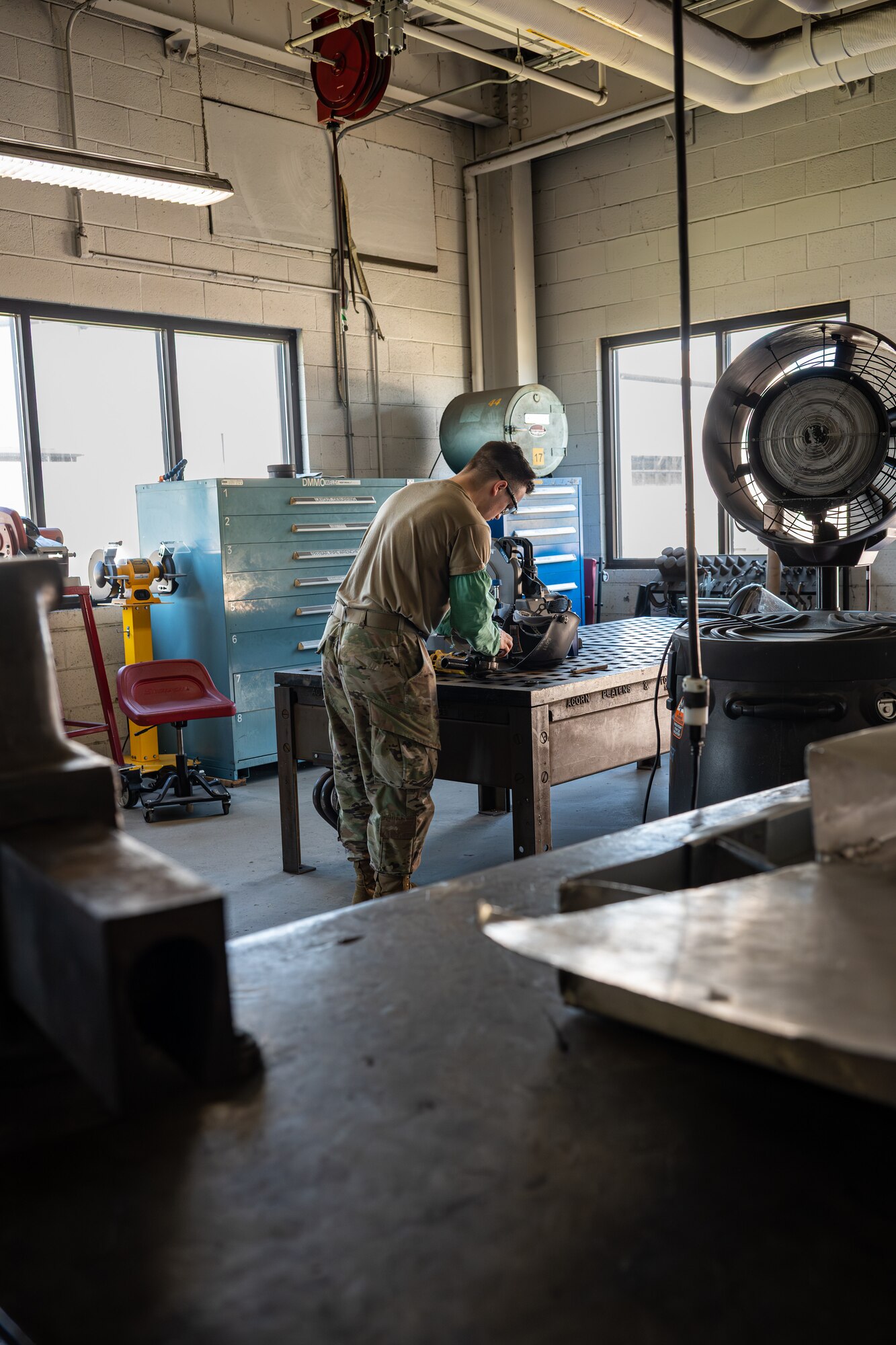 U.S. Air Force Airman 1st Class Matthew Trees, 436th Maintenance Squadron metals technology apprentice, prepares the angle grinder for use on a small cart on Dover Air Force Base, Delaware, June 4, 2026.