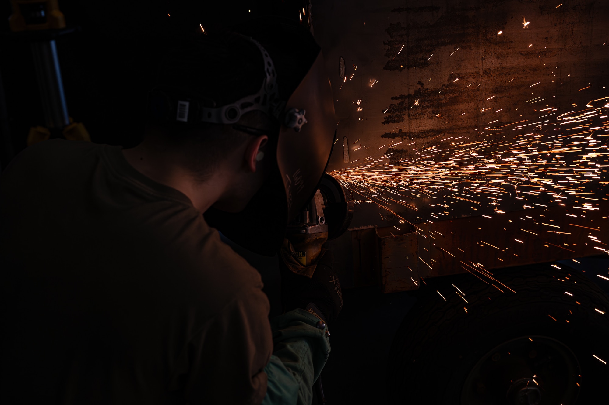 U.S. Air Force Airman 1st Class Matthew Trees, 436th Maintenance Squadron metals technology apprentice, uses an angle grinder to smooth out the edges of a cart on Dover Air Force Base, Delaware, June 4, 2026.