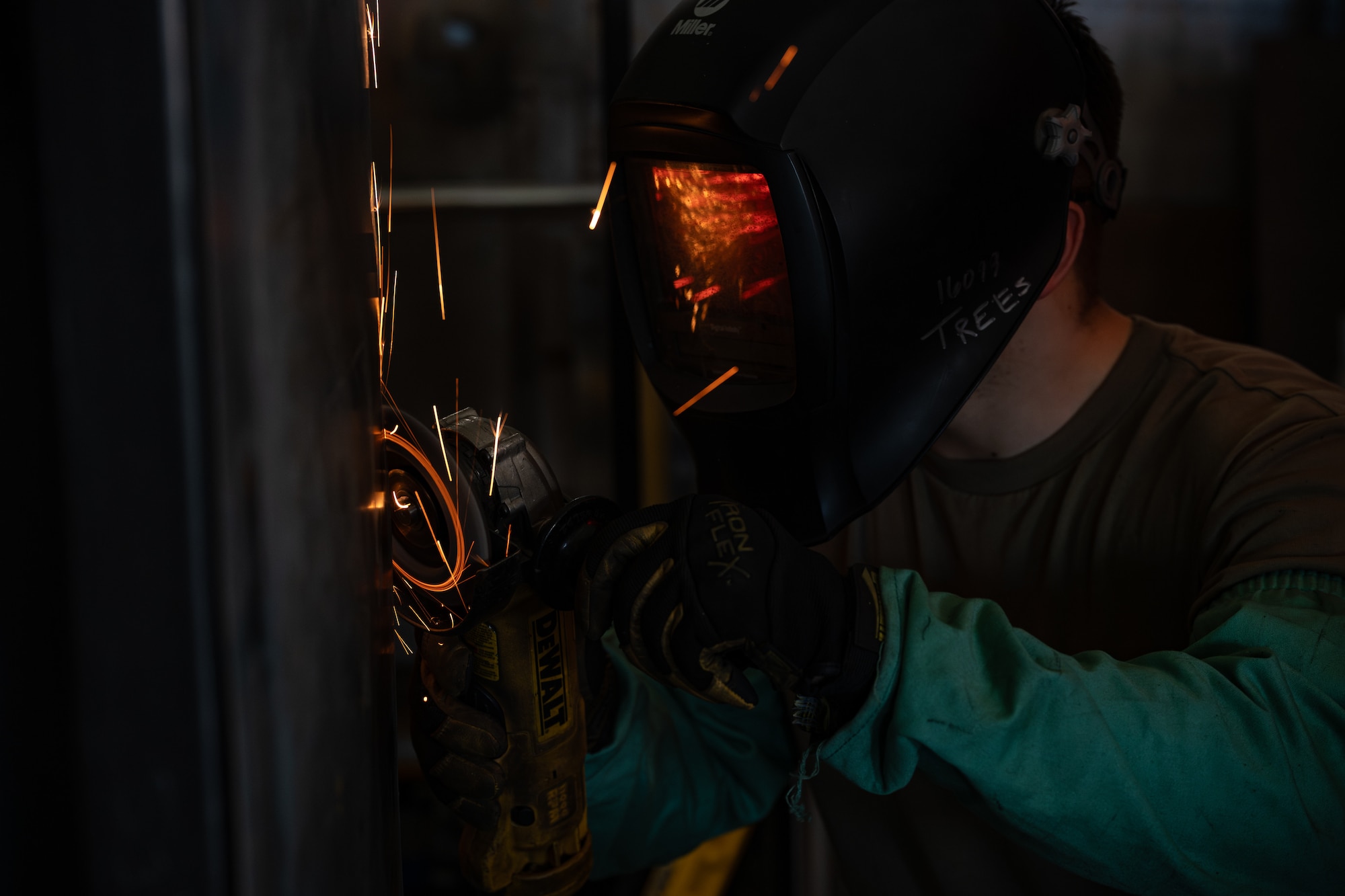 U.S. Air Force Airman 1st Class Matthew Trees, 436th Maintenance Squadron metals technology apprentice, uses an angle grinder on the corners of a cart on Dover Air Force Base, Delaware, June 4, 2026.