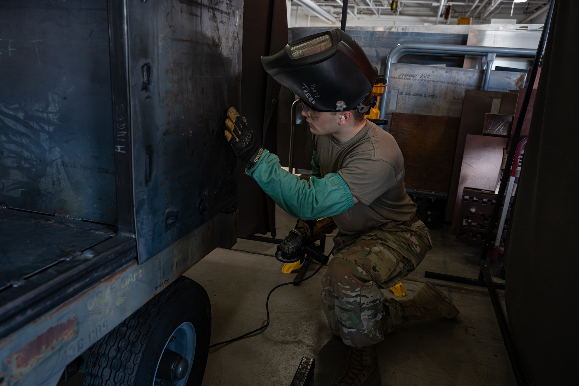 U.S. Air Force Airman 1st Class Matthew Trees, 436th Maintenance Squadron metals technology apprentice, checks his work on a metal cart that will be used to carry tools and small machinery on Dover Air Force Base, Delaware, June 4, 2026.