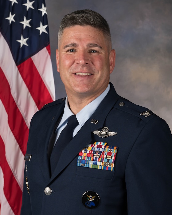 Colonel Joshua A. Moores, 97th Air Mobility Wing deputy commander, poses for an official studio portrait at Altus Air Force Base, Oklahoma, June 9, 2026. Moores was previously the director of the NORAD/USNORTHCOM Joint Integrated Space Team. (U.S. Air Force photo by Airman 1st Class Nathan Langston)