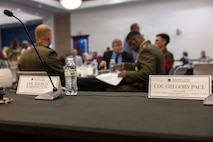 Name placards for U.S. Marine Corps Col. Gregory Pace, commanding officer, Marine Corps Installations East–Marine Corps Base Camp Lejeune, and Col. Thomas C. Farrington II, commanding officer, Marine Corps Air Station New River, at the 2026 State of the Community Luncheon at the Onslow County Government Center, in Jacksonville, North Carolina, June 4, 2026. This event highlighted the importance of collaboration between military, local government, businesses and community organizations. (U.S. Marine Corps Photo by Cpl. Jessica J. Mazzamuto)