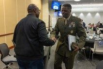 U.S. Marine Corps Col. Gregory Pace, right, commanding officer, Marine Corps Installations East–Marine Corps Base Camp Lejeune, greets a community member during the 2026 State of the Community Luncheon at the Onslow County Government Center, in Jacksonville, North Carolina, June 4, 2026. This event highlighted the importance of collaboration between military, local government, businesses and community organizations. (U.S. Marine Corps Photo by Cpl. Jessica J. Mazzamuto)