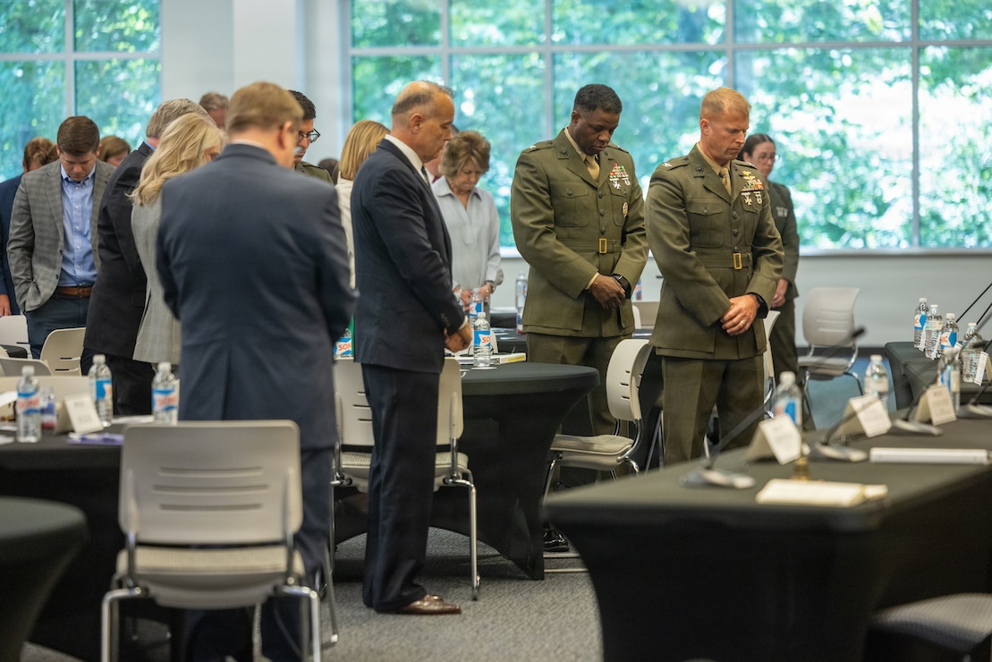 U.S. Marine Corps senior leaders with Marine Corps Installations East–Marine Corps Base Camp Lejeune and community members bow their heads for an invocation during the 2026 State of the Community Luncheon at the Onslow County Government Center, in Jacksonville, North Carolina, June 4, 2026. This event highlighted the importance of collaboration between military, local government, businesses and community organizations. (U.S. Marine Corps Photo by Cpl. Jessica J. Mazzamuto)