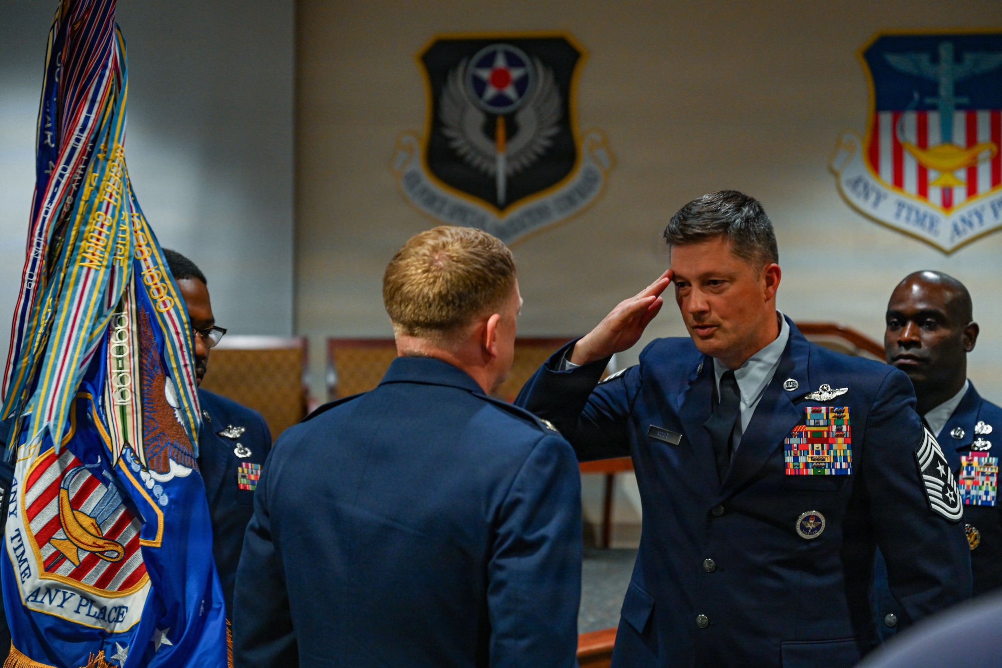 Chief Master Sgt. Joshua Moore, 1st Special Operations Wing incoming command chief, salutes Col. Mark Hamilton, 1st SOW commander, during a change of responsibility ceremony at Hurlburt Field, Florida, June 5, 2026.