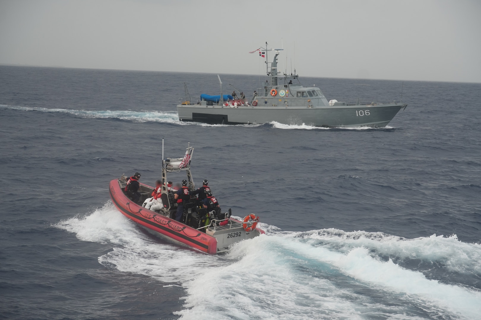 Coast Guard Cutter Heriberto Hernandez's small boat transfers a group of people during the repatriation of 32 aliens to a Dominican Republic Navy vessel, June 7, 2026.  The aliens were interdicted a day earlier off Desecheo, Puerto Rico, as part  of Homeland Security Task Force – San Juan Region efforts to combat human smuggling and deter unlawful maritime migration.(U.S. Coast Guard photo)