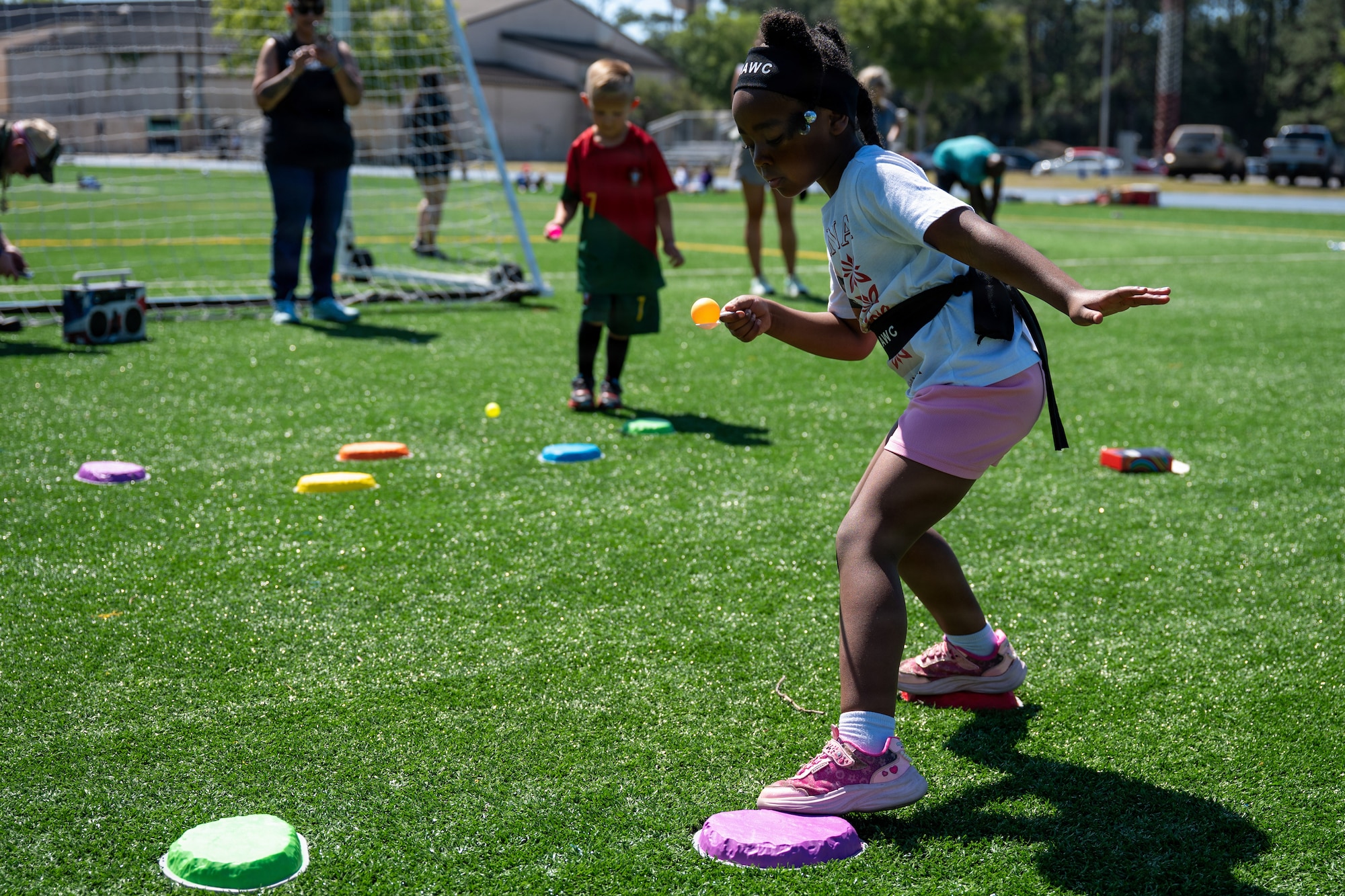 Military children participate in an obstacle course during Operation Discovering and Exploring Military Operations at Hurlburt Field, Florida, April 11, 2026.