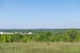 A portion of Tobyhanna Army Depot's radar testing campus - one white domed structure in the foreground and one more in the distance are seen.