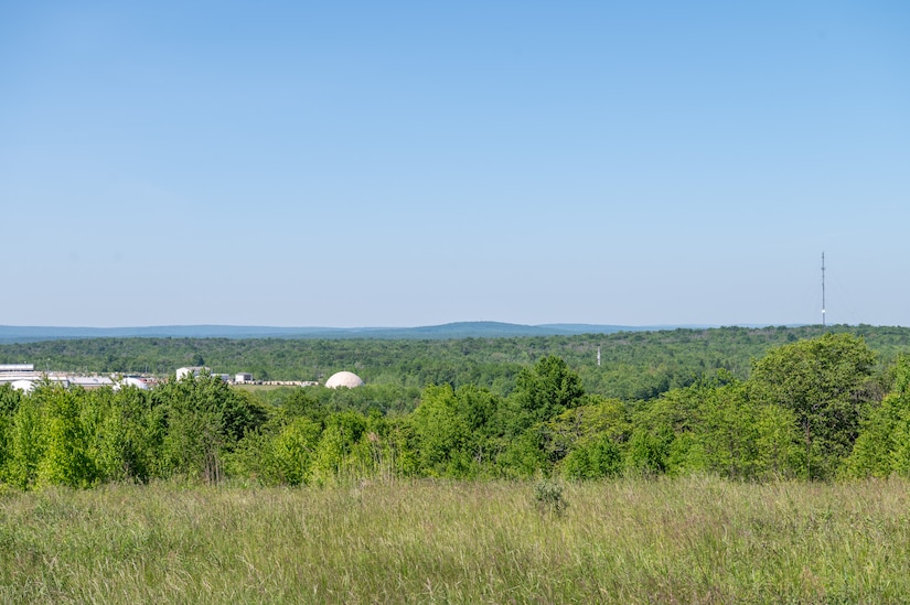 A portion of Tobyhanna Army Depot's radar testing campus - one white domed structure in the foreground and one more in the distance are seen.