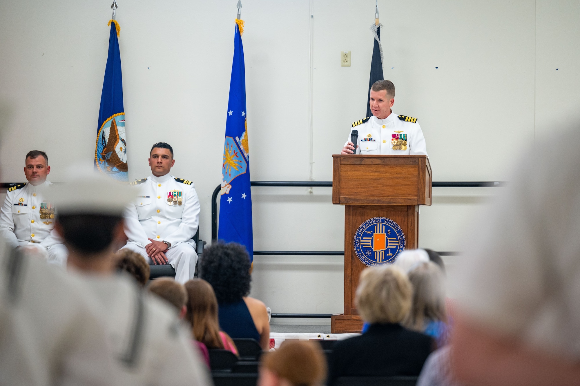 Capt Justin C. Collins, commanding officer of the Navy Reserve Center San Diego, gives his remarks during the NRC Albuquerque change of command at Kirtland Air Force Base, N. M., June 7, 2026. During the ceremony, Lieutenant Commander Lazaro Cardenas relieved Commander Nicholas Bularzik of his duties commanding NRC Albuquerque. (U.S. Air Force photo by Tech. Sgt. Gabrielle Winn)