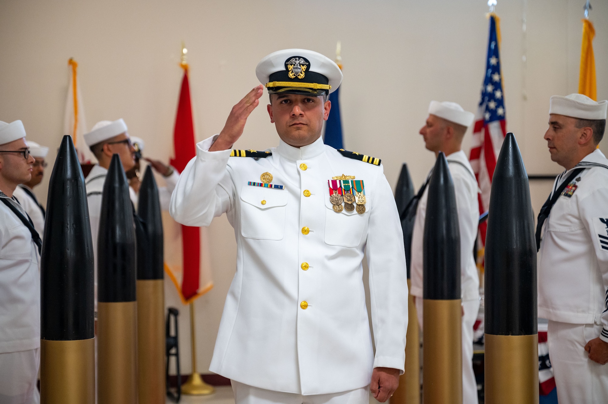 Lieutenant Commander Lazaro Cardenas, Navy Reserve Center Albuquerque commander, renders a salute during a change of command ceremony at Kirtland Air Force Base, N. M., June 7, 2026. As the sole Navy outpost in the state, the mission of NRC Albuquerque is to generate, maintain, and deliver mobilization readiness for over 175 Navy Reserve Sailors. (U.S. Air Force photo by Tech. Sgt. Gabrielle Winn)